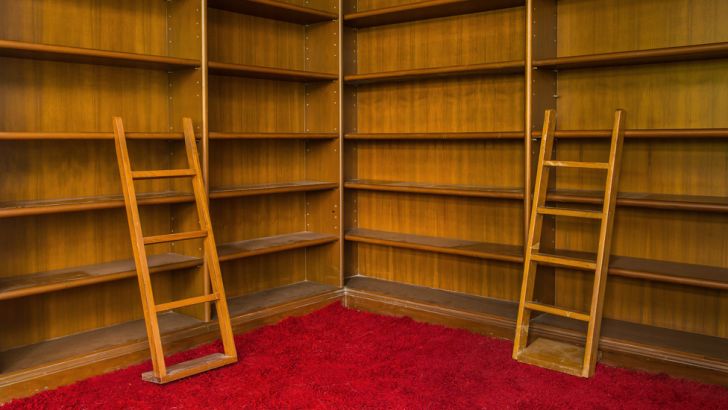Swanky bookshelf sitting on the corner